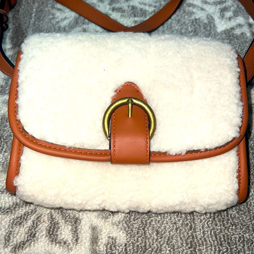 Brown Sherpa crossbody.